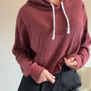 Maroon colored long sleeve pullover